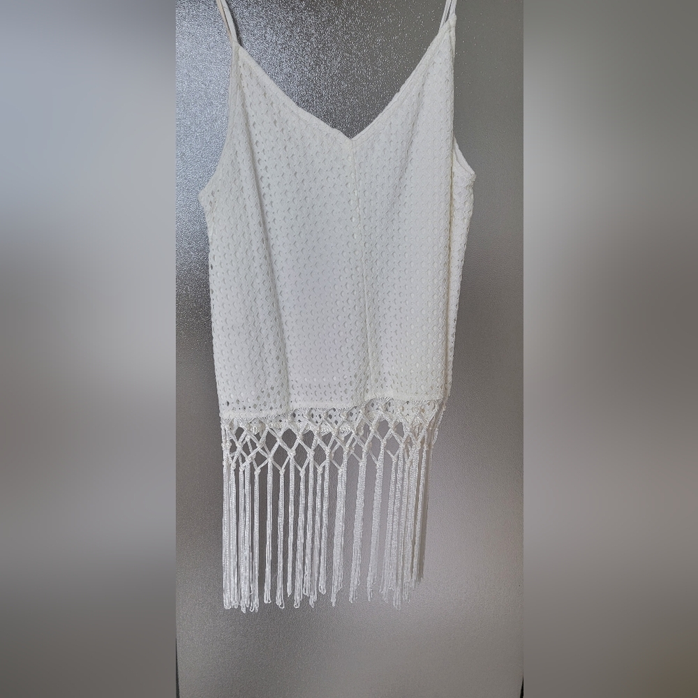 Cute spaghetti strap fringe top.